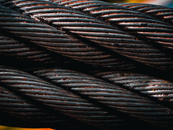 Close view of twisted steel wire rope strands
