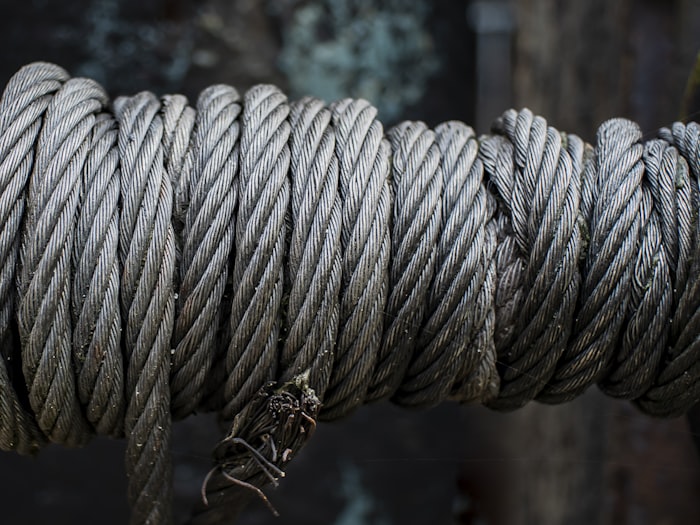 Steel wire rope coiled around a mooring bollard