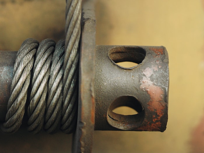Steel wire rope running through a heavy duty fitting